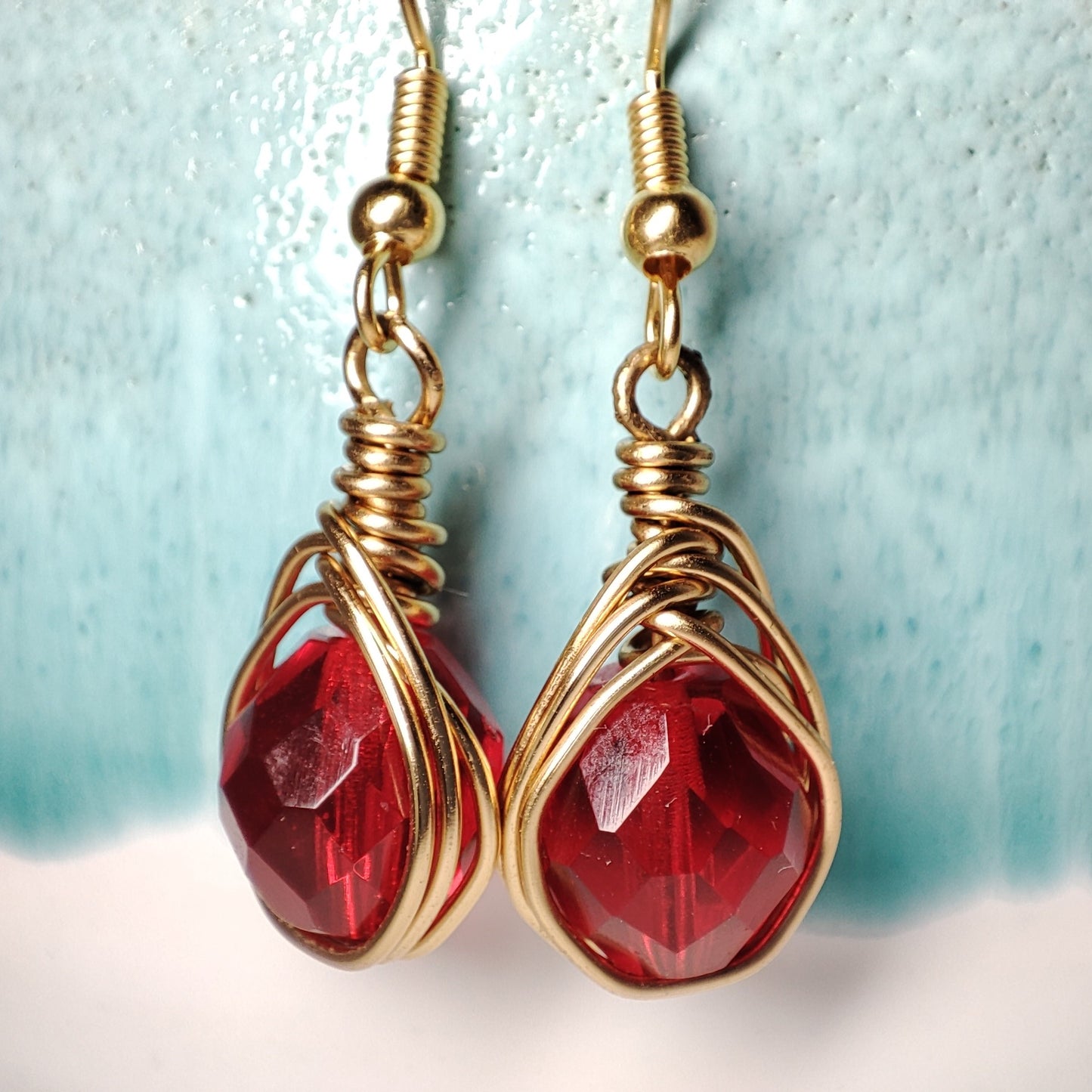 Wire earrings featuring a vibrant bead