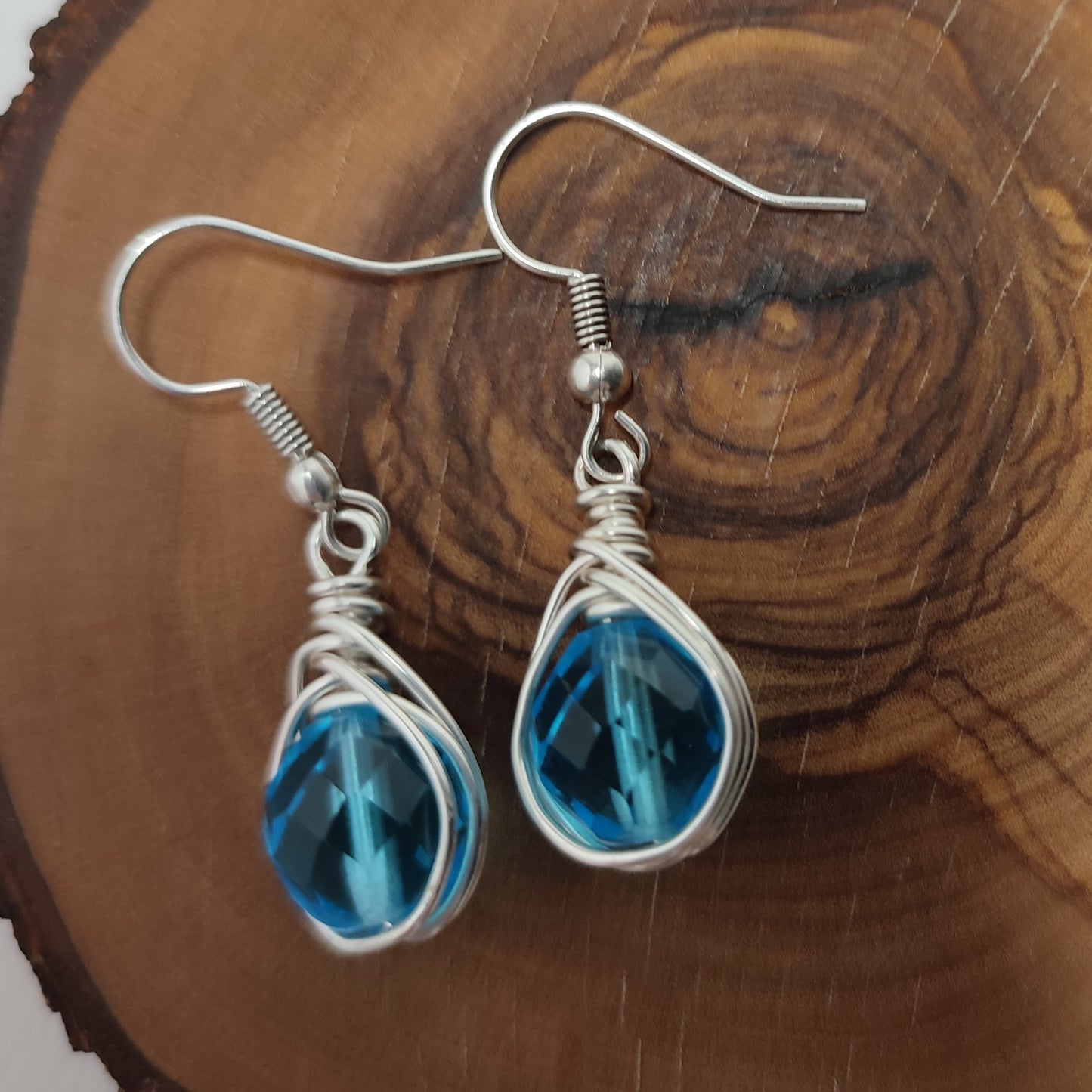 Wire earrings featuring a vibrant bead