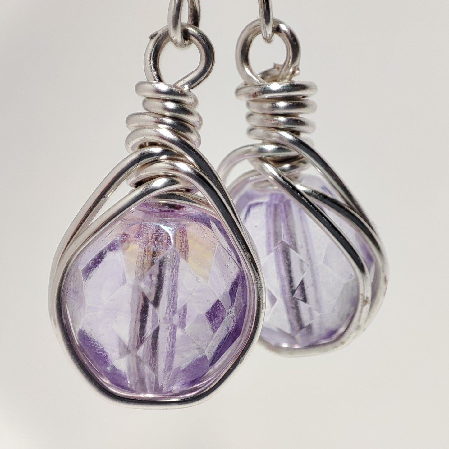 Wire earrings featuring a vibrant bead