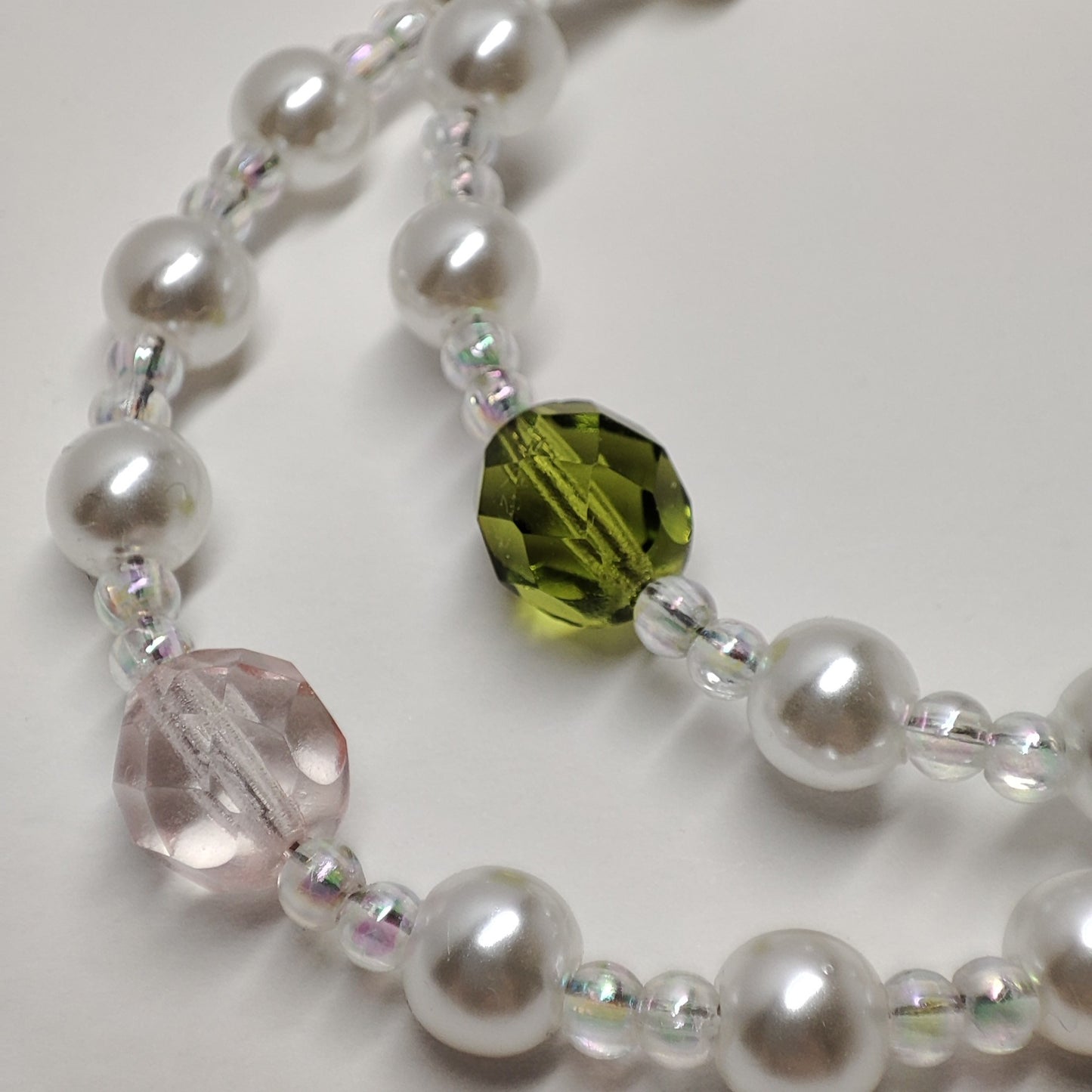 White faux bead bracelet with a series of lustrous faux pearl-like beads