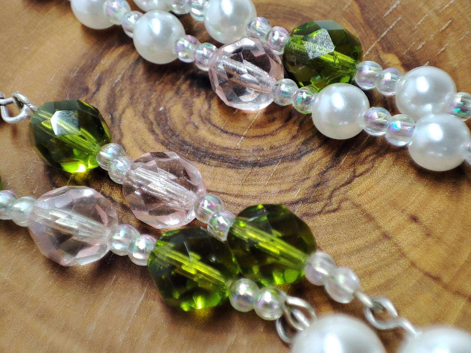 Long wire pearl earrings with green and pink colored beads