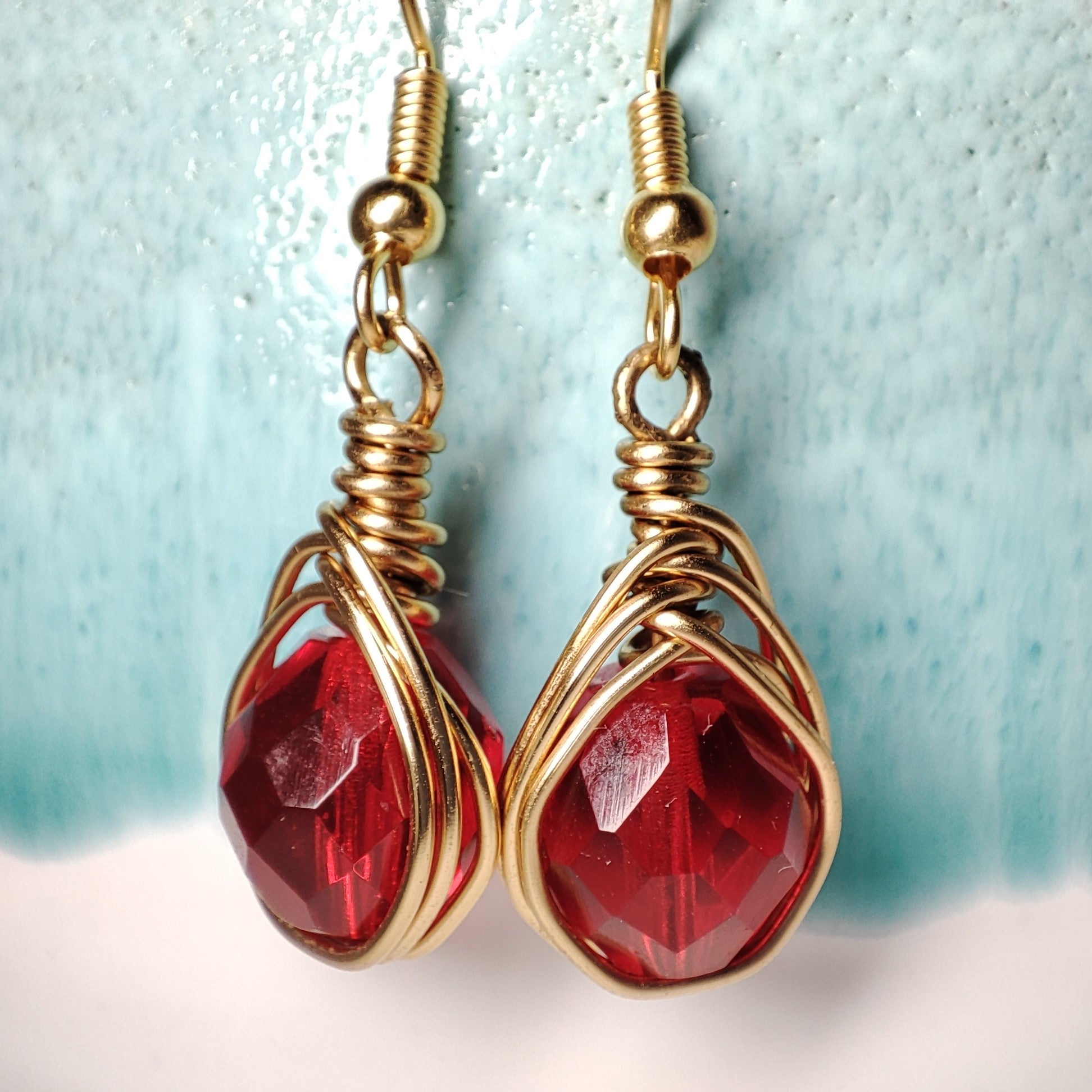 Wire earrings featuring a vibrant bead