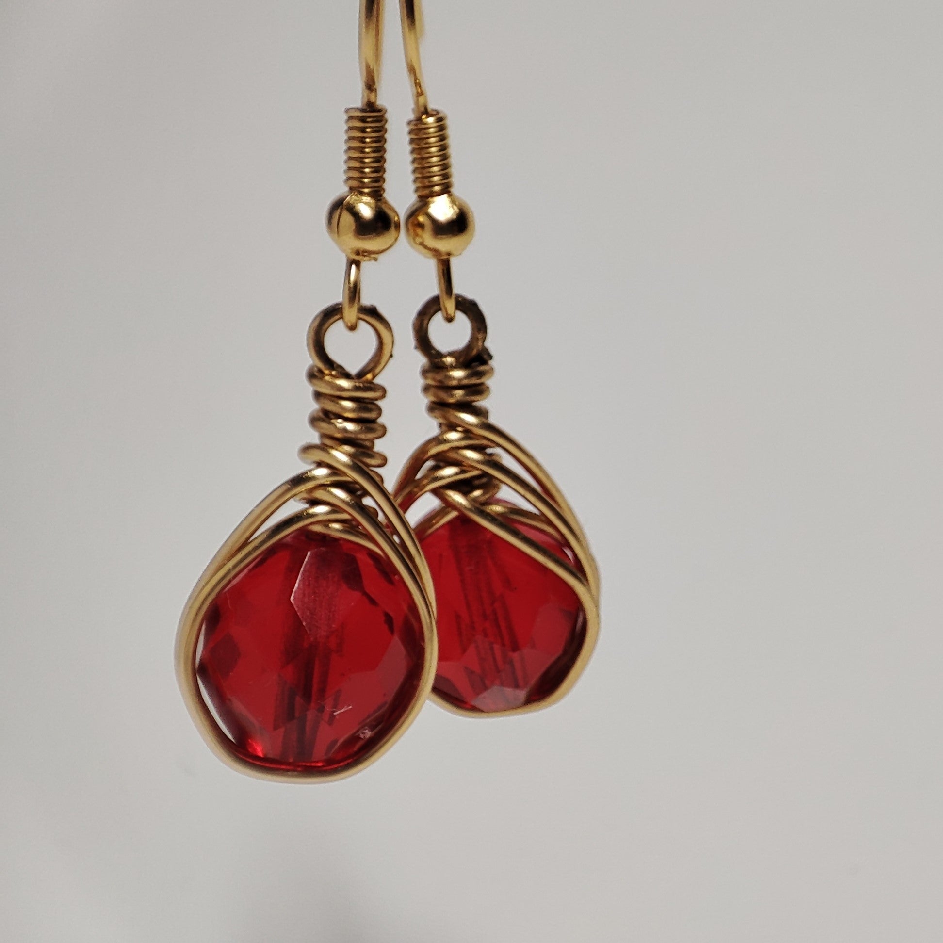 Wire earrings featuring a vibrant bead