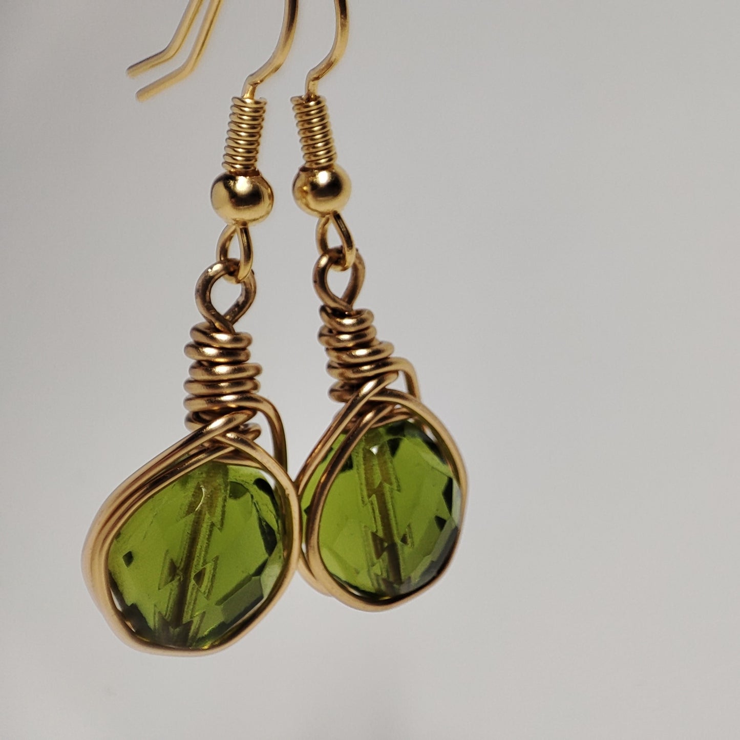 Wire earrings featuring a vibrant bead