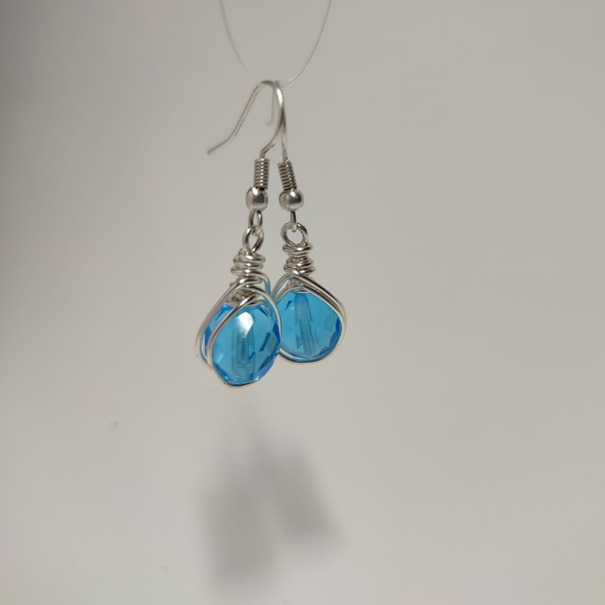 Wire earrings featuring a vibrant bead
