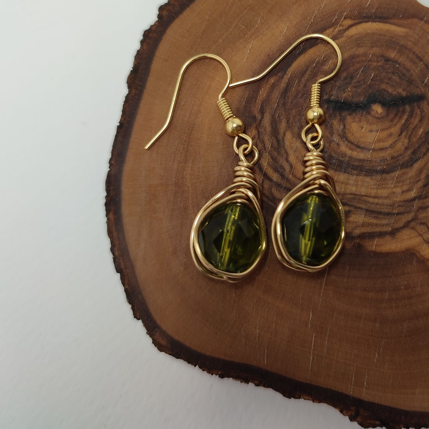 Wire earrings featuring a vibrant bead