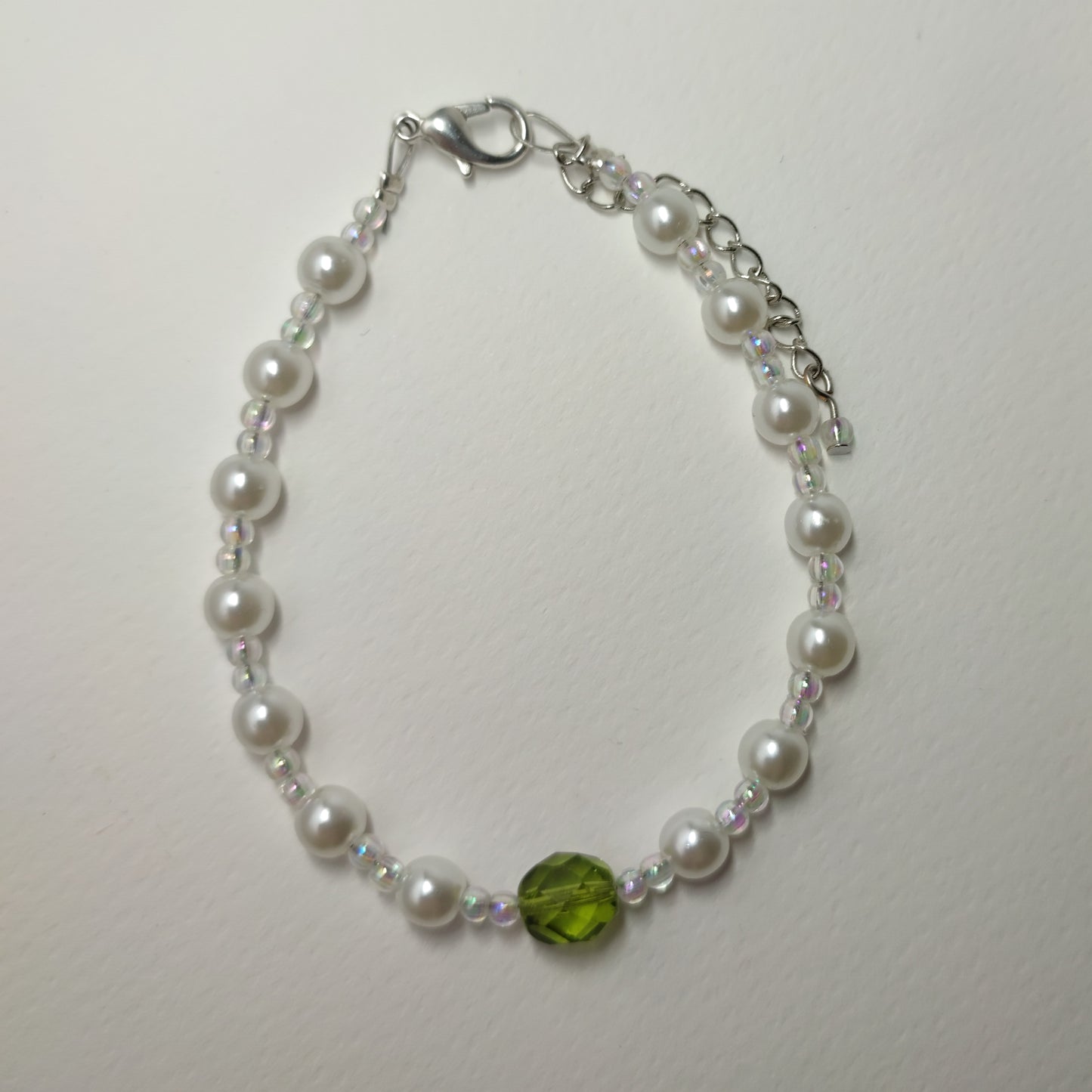 White faux bead bracelet with a series of lustrous faux pearl-like beads