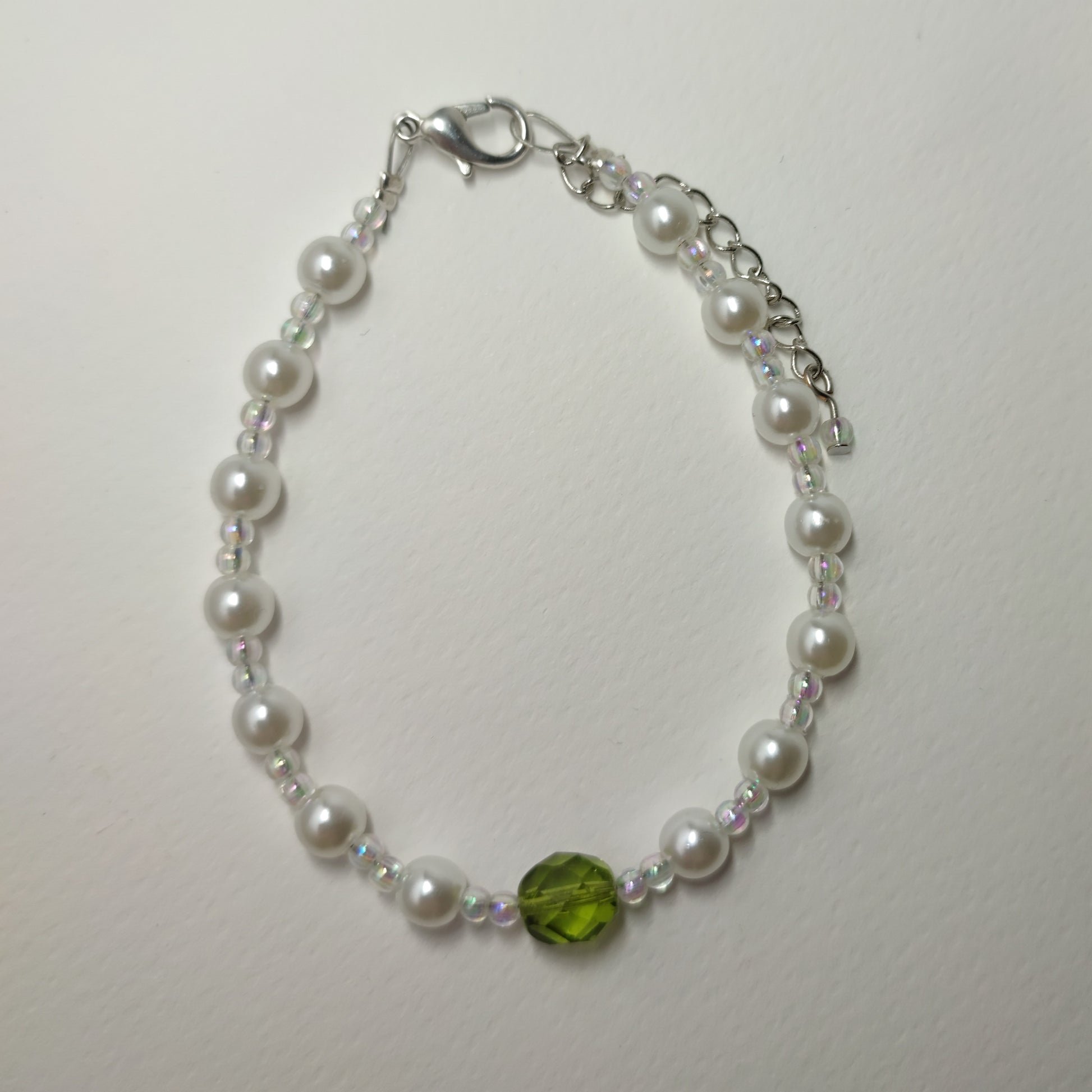 White faux bead bracelet with a series of lustrous faux pearl-like beads