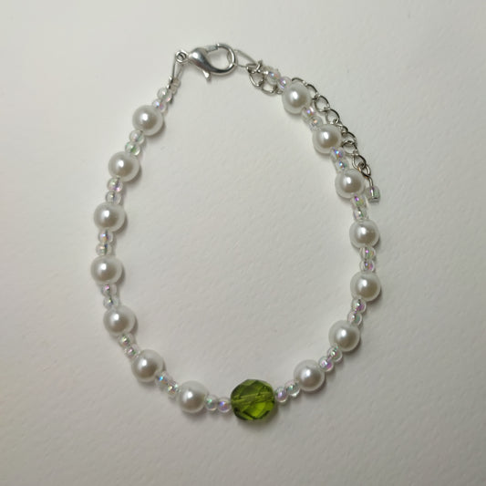 White faux bead bracelet with a series of lustrous faux pearl-like beads