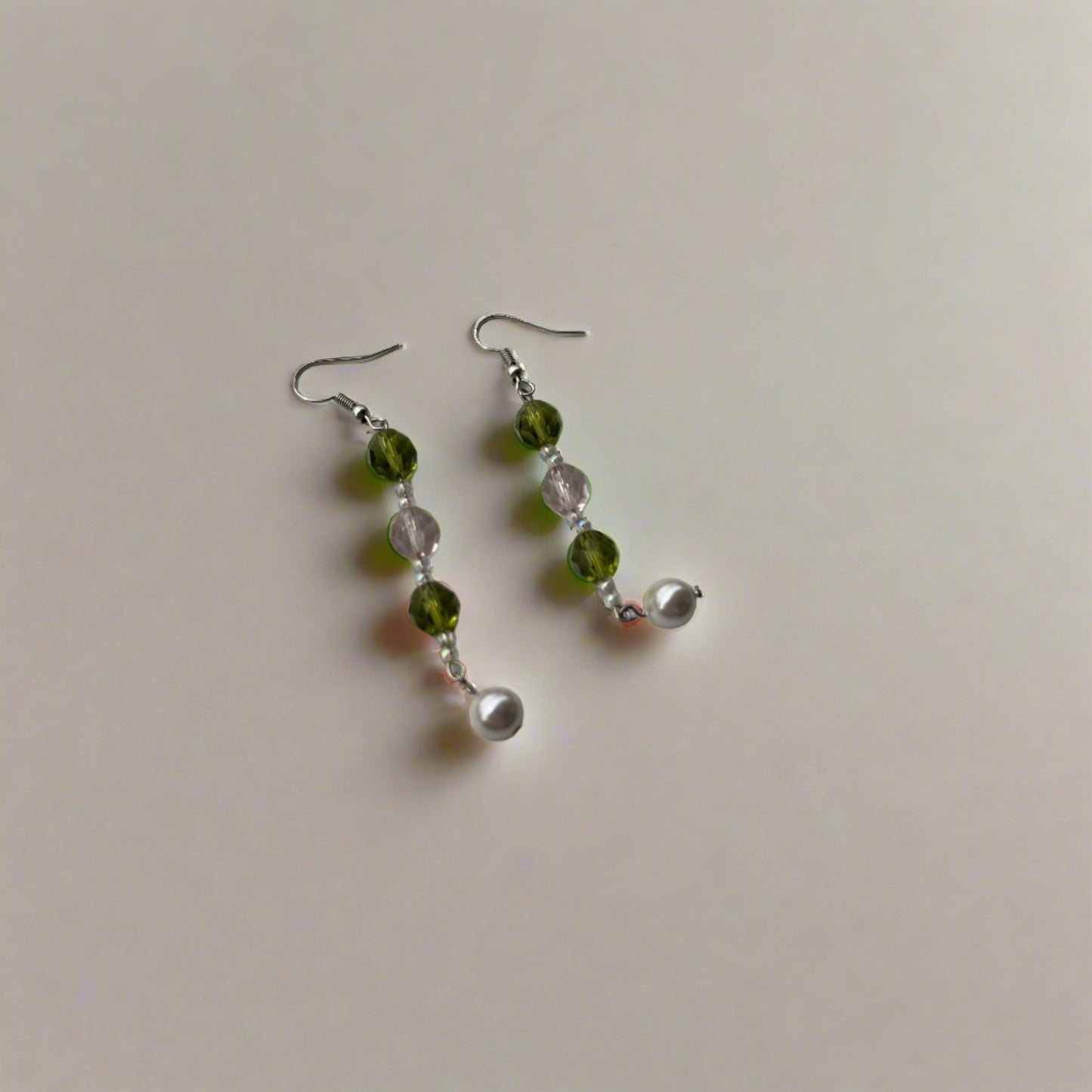 Long wire pearl earrings with green and pink colored beads