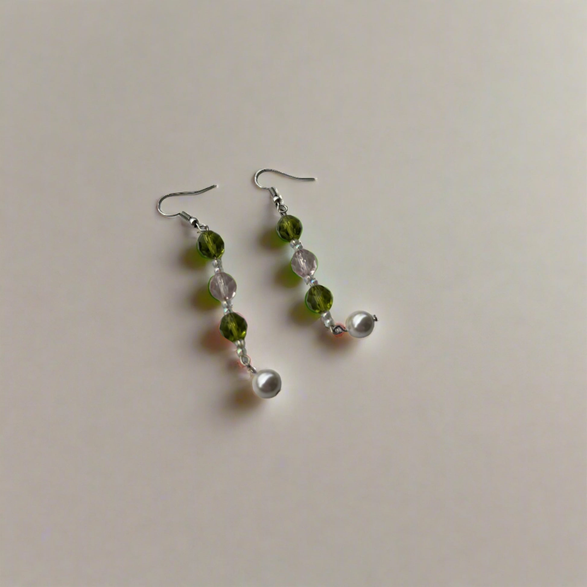 Long wire pearl earrings with green and pink colored beads